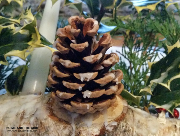 Easy Christmas Craft for Kids - Step 4 adding hot wax to the decoration - How to make a yule log decoration